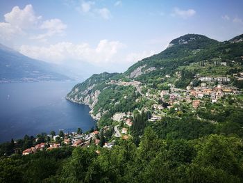 High angle view of townscape and mountains against sky