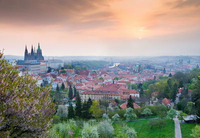 Cityscape against sky at sunset