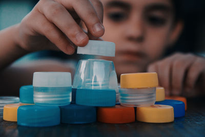 Midsection of woman holding pills