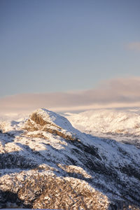 Scenic view of snowcapped mountains against clear sky