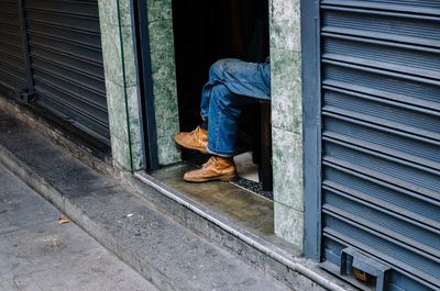 Man seen through closed door of window