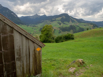 Scenic view of landscape and mountains against sky