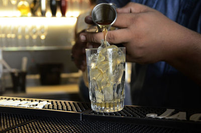 Close-up of cropped beer glass