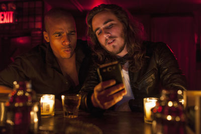 Young men hanging out at a nightclub