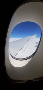 Low angle view of building seen through window
