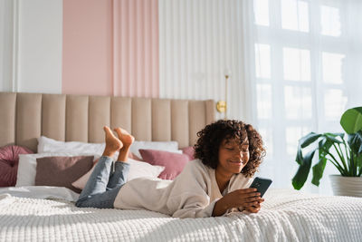 Young woman sleeping on bed at home