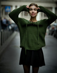 Young woman standing in city