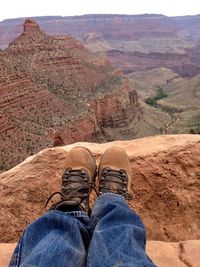 Low section of man wearing shoes