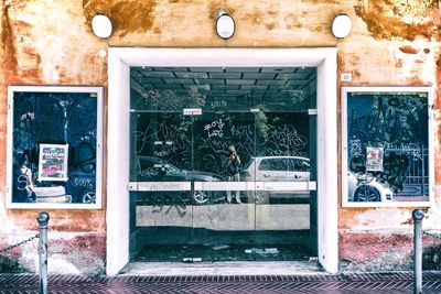 Reflection of building on glass window