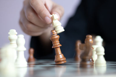 Low angle view of man playing with chess