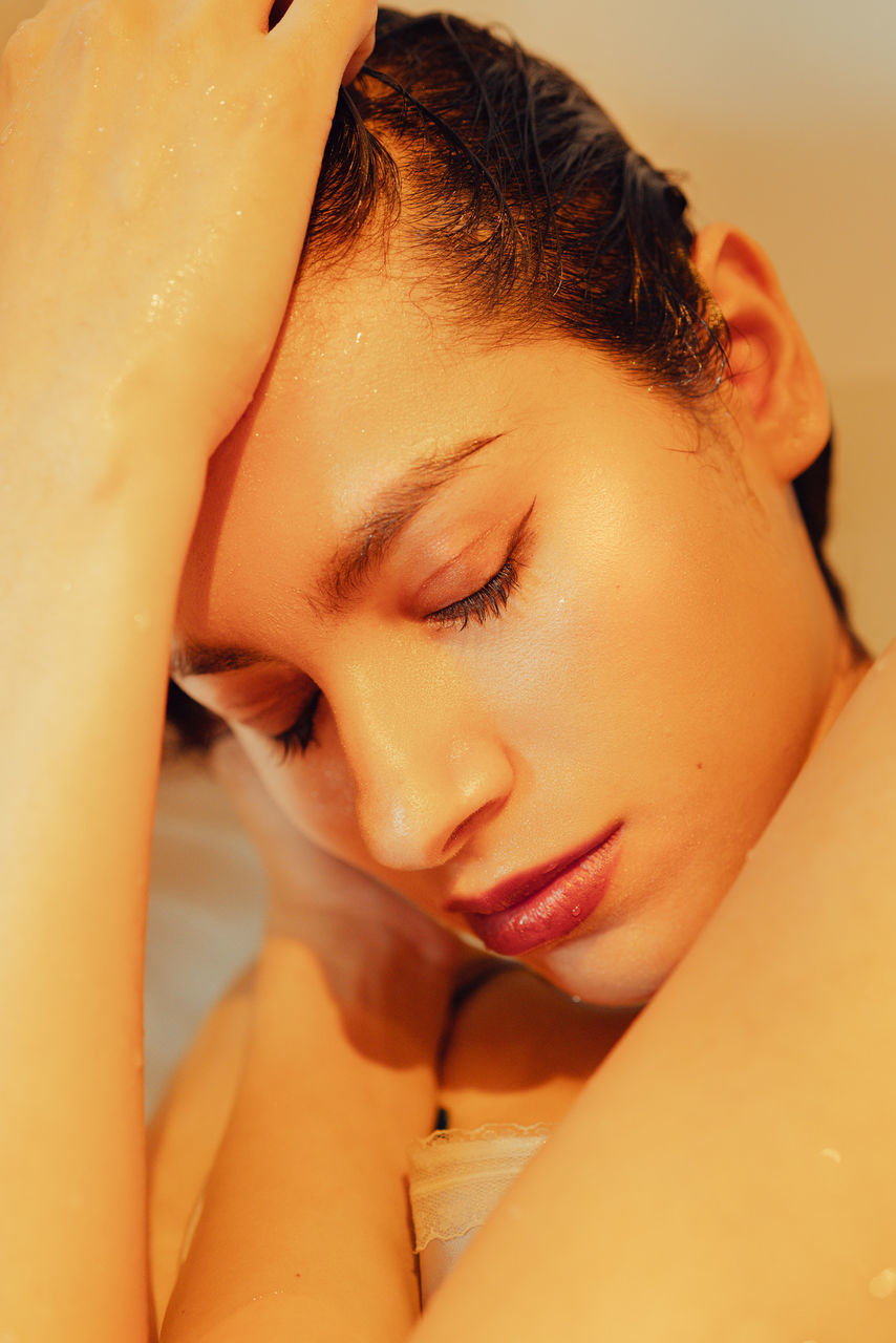 headshot, relaxation, close-up, one person, indoors, real people, eyes closed, young adult, bathroom, leisure activity, domestic bathroom, lying down, portrait, bathtub, lifestyles, wet, domestic room, beautiful woman, beauty, human face