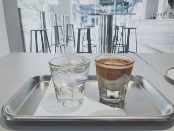 Glass of coffee on table