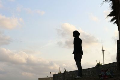 Silhouette man statue against sky