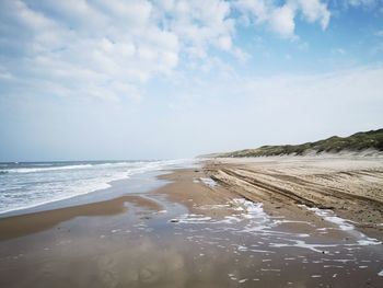 Scenic view of beach against sky