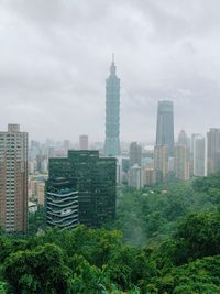 Buildings in city against sky