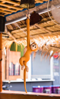 Close-up of stuffed toy hanging in amusement park