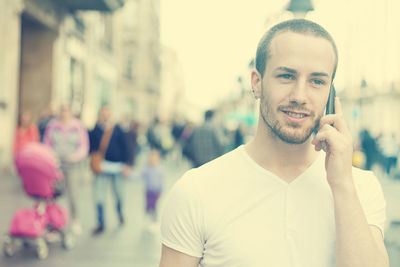 Close-up portrait of young man standing outdoors