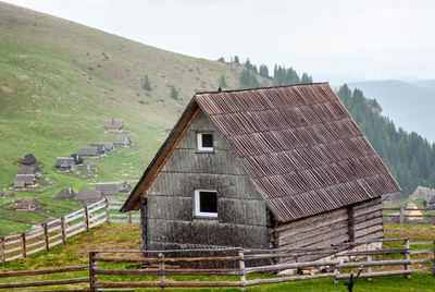 House on field against sky