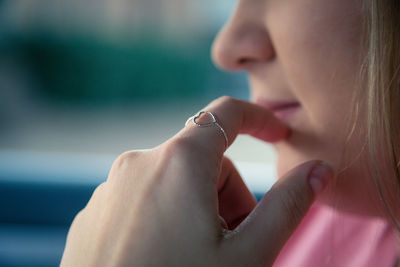 Close-up of womans hand wearing ring