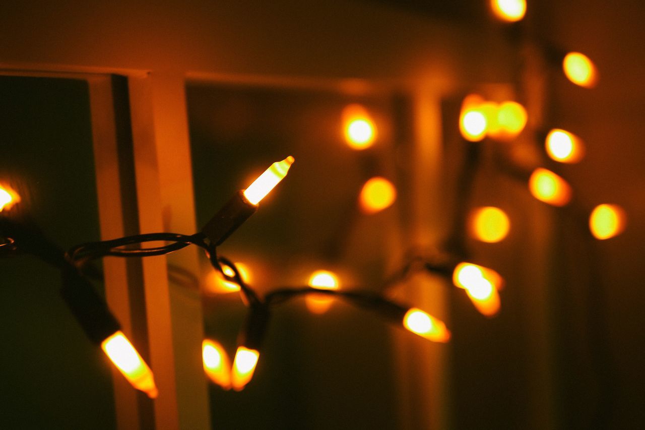 illuminated, lighting equipment, glowing, no people, light - natural phenomenon, night, decoration, close-up, electricity, indoors, light, event, electric light, celebration, focus on foreground, burning, candle, fire - natural phenomenon, christmas lights, selective focus