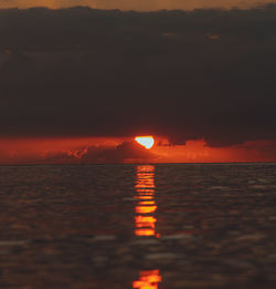 Scenic view of sea against romantic sky at sunset