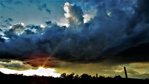 Low angle view of dramatic sky during sunset