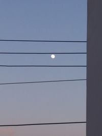 Low angle view of moon against clear sky