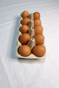 High angle view of eggs in container on table