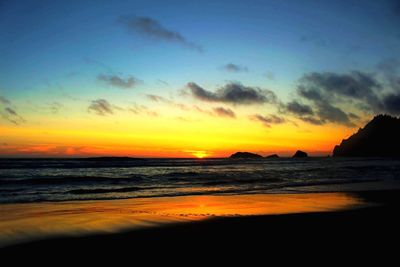 View of beach at sunset