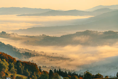 Scenic view of mountains against sky during sunset