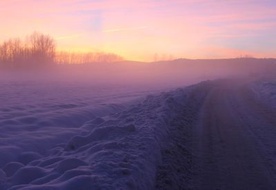 Scenic view of landscape against sky during sunset