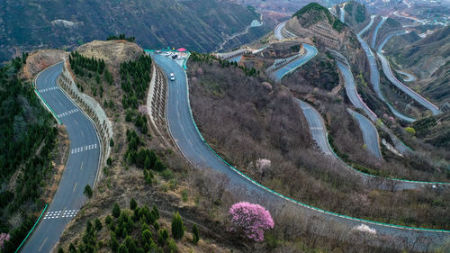 High angle view of road amidst mountains