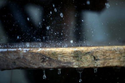 Close-up of wet metal railing during rainy season