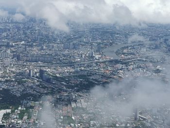 Aerial view of cityscape against sky