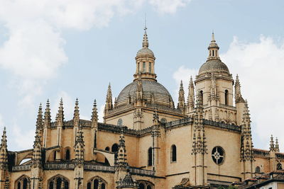 Low angle view of cathedral against cloudy sky