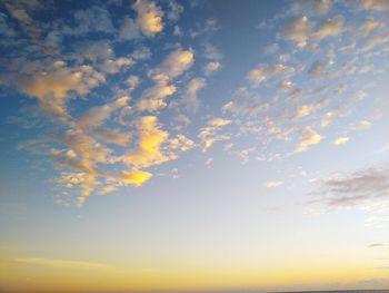 Low angle view of dramatic sky during sunset