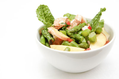 Close-up of salad in bowl on white background