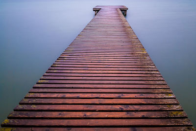 Boardwalk against clear sky