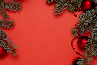 Directly above shot of christmas decorations on yellow background