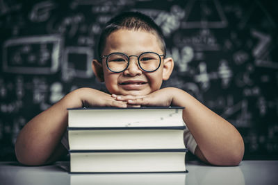 Portrait of boy with open book