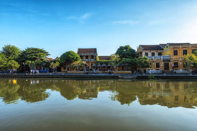 Thu bon river and an hoi town reflection taken from hoi an ancient town river bank.