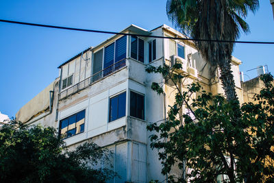 Low angle view of building against clear blue sky