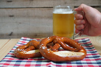 Pretzel with beer on wood table,oktober background.