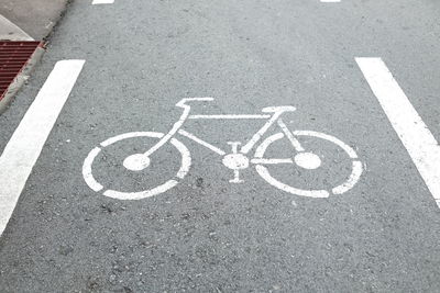 High angle view of arrow sign on road