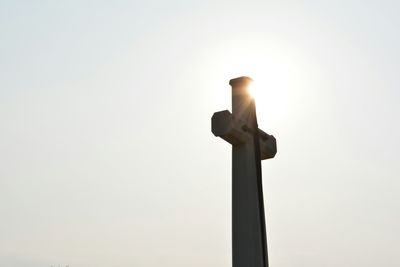 Low angle view of statue against sky