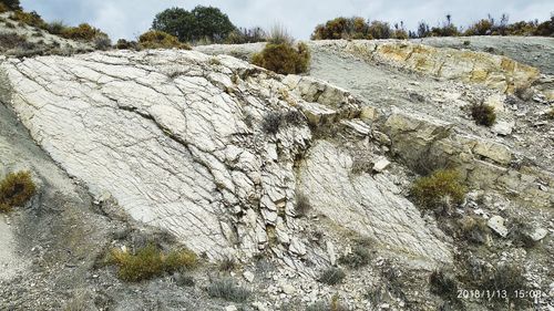 Close-up of rocks against sky