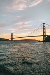 View of suspension bridge over sea