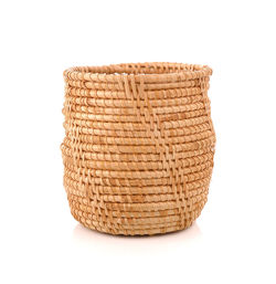 Close-up of wicker basket against white background