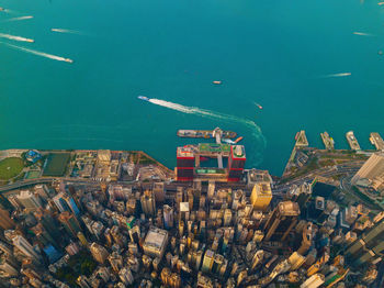 High angle view of sea and buildings in city