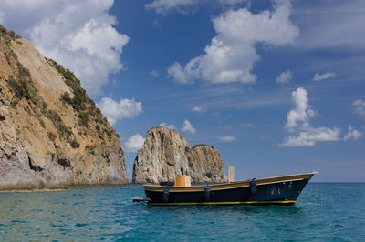 Boat in sea against sky